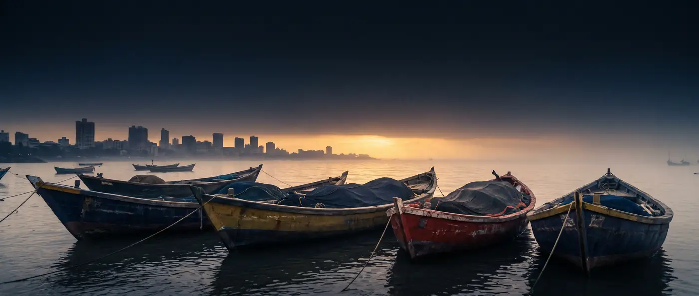 Fishing boats moored in mist at sunrise