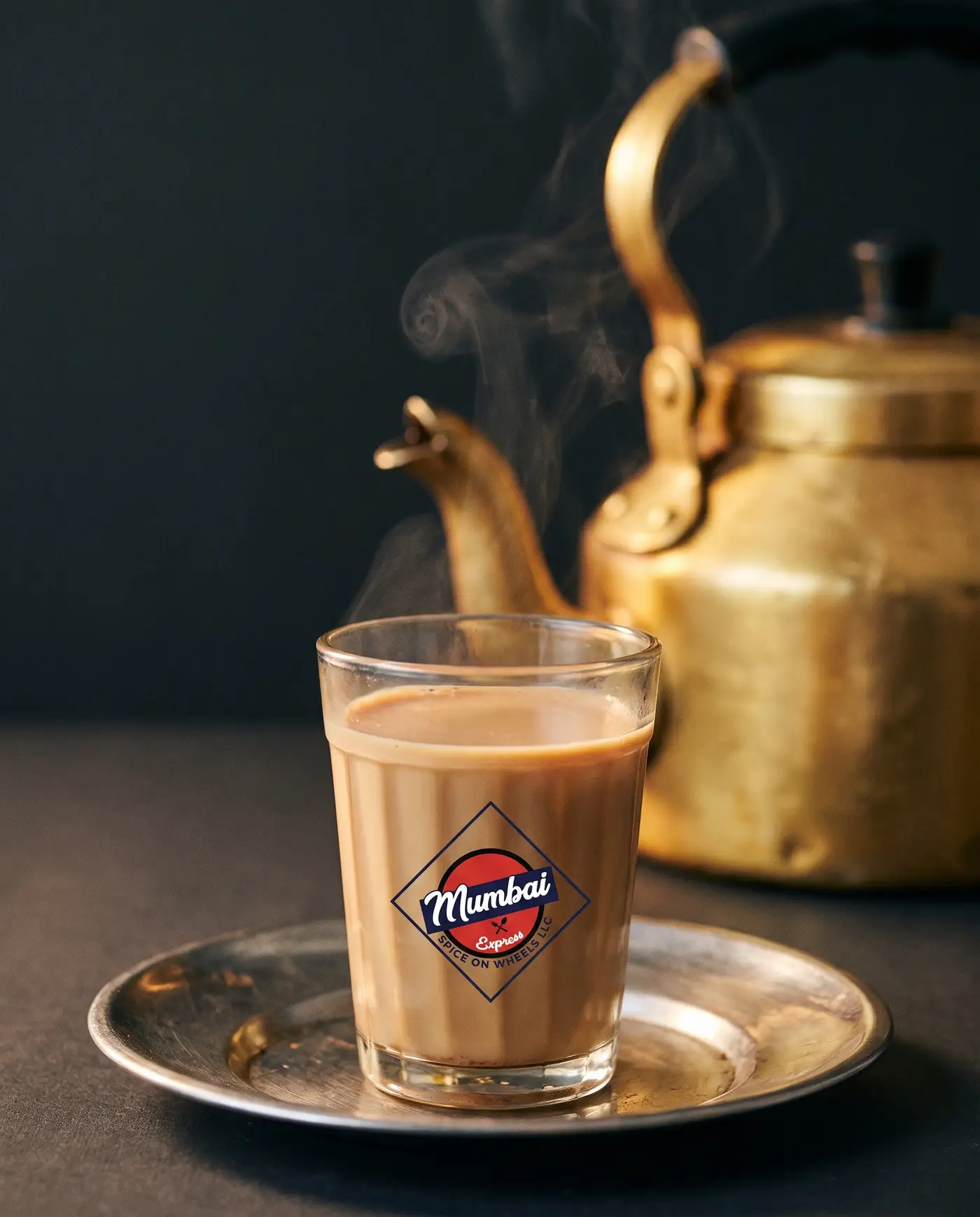A glass of cutting chai printed with the Mumbai Express mark
